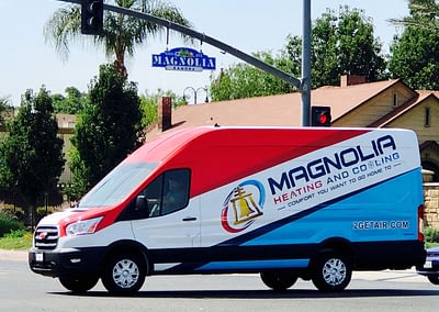 Magnolia Heating & Cooling van on the street