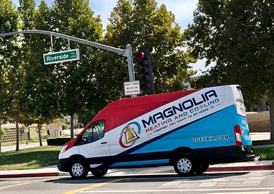 Magnolia Heating & Cooling van on the street