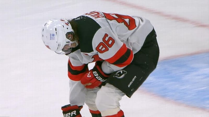 J. Hughes exits Devils' 2-0 loss after collision