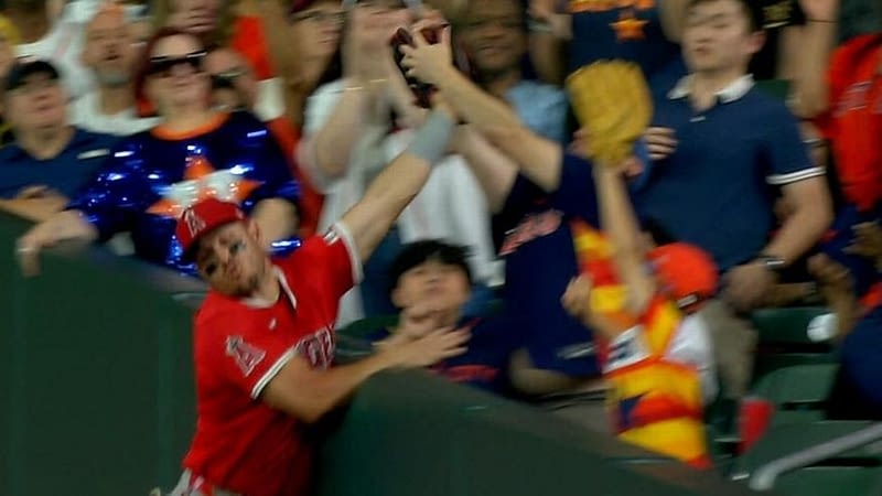 Fan reaches into Trout's glove to snatch a catch