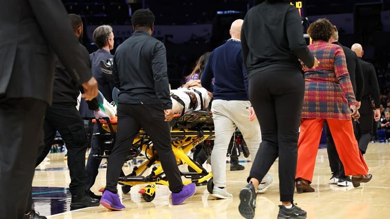 Grizz's Wells taken off in stretcher after hard fall