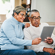 senior couple using a digital tablet at home
