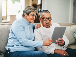 senior couple using a digital tablet at home