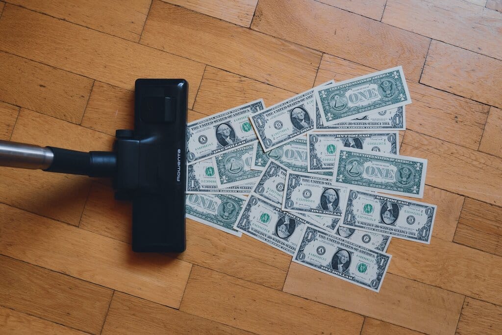 a person hoovering up cash