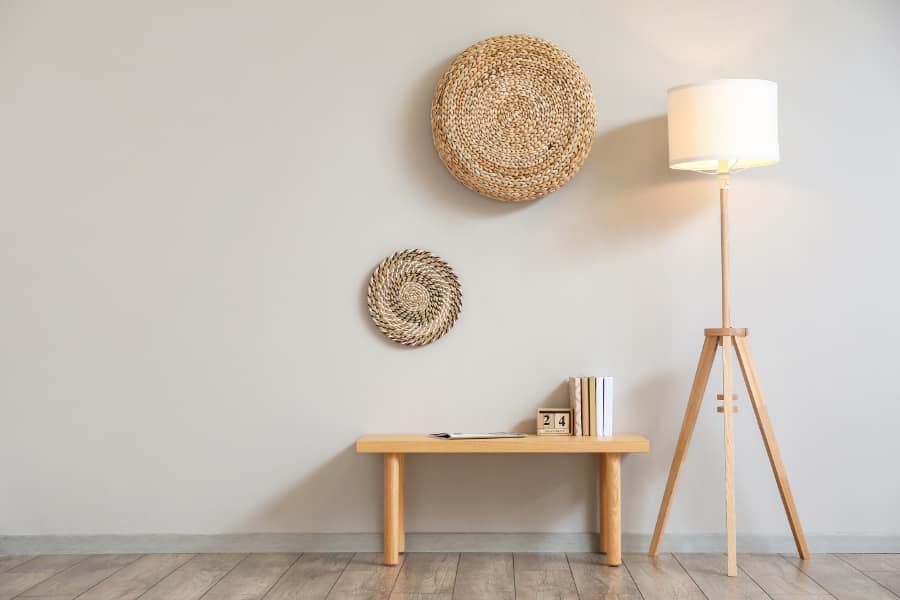 a floor lamp next to a small table