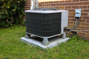 air conditioning unit outside brick home