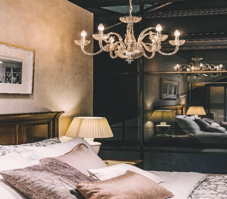 a modern bedroom with a chandelier