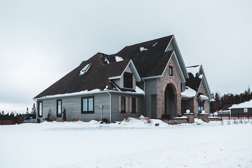 a large philadelphia house covered in snow