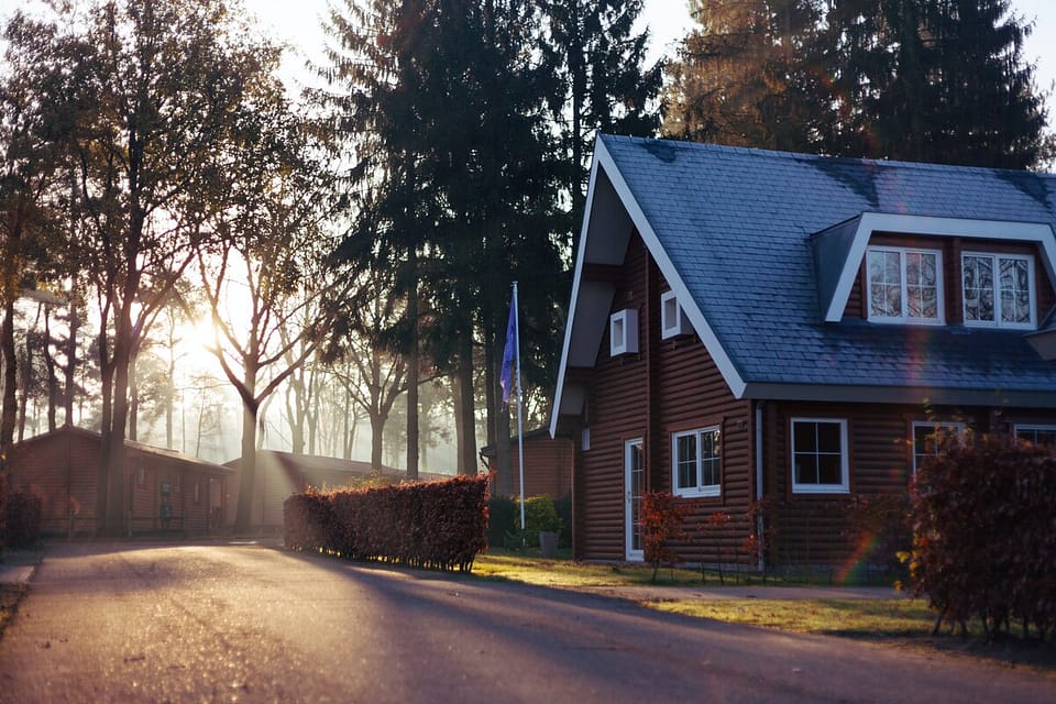 a property by a road with trees outside