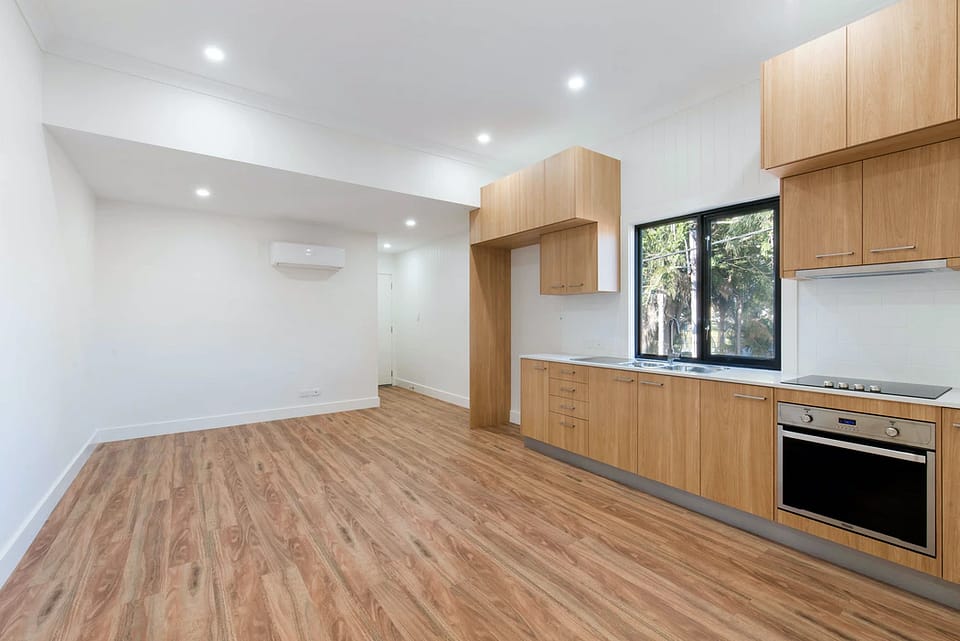an unfurnished kitchen lounge interior in a property