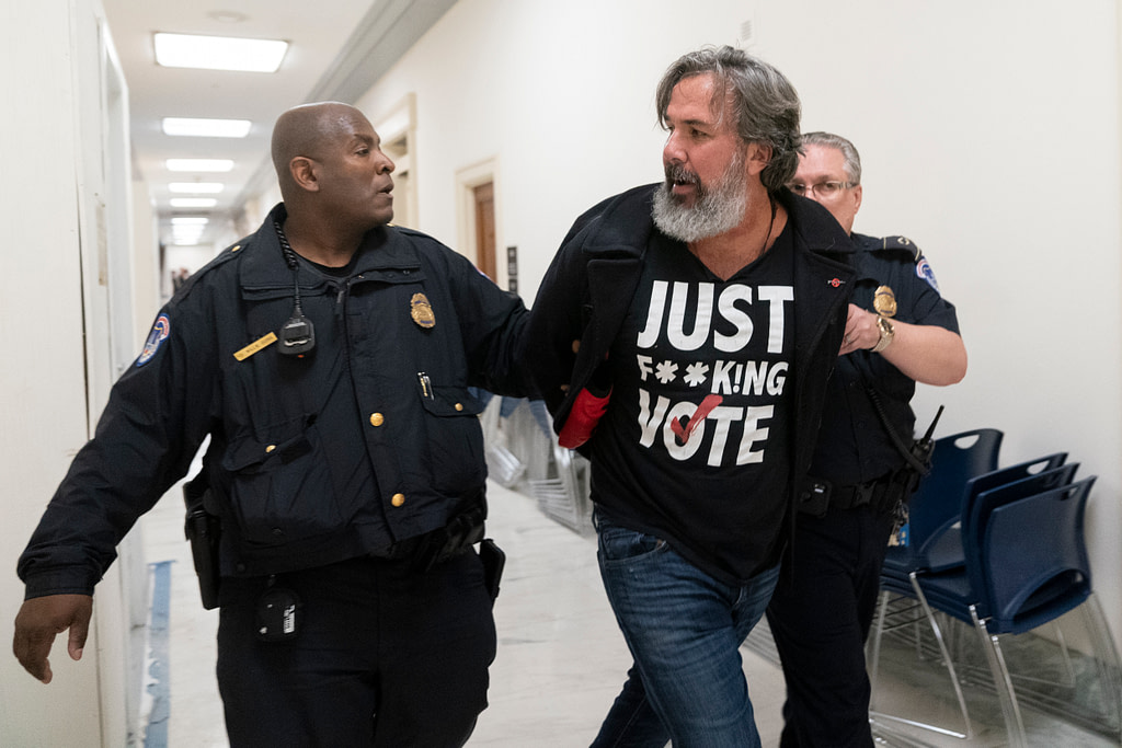 Gun rights hearing turns chaotic amid arrest of Parkland parent