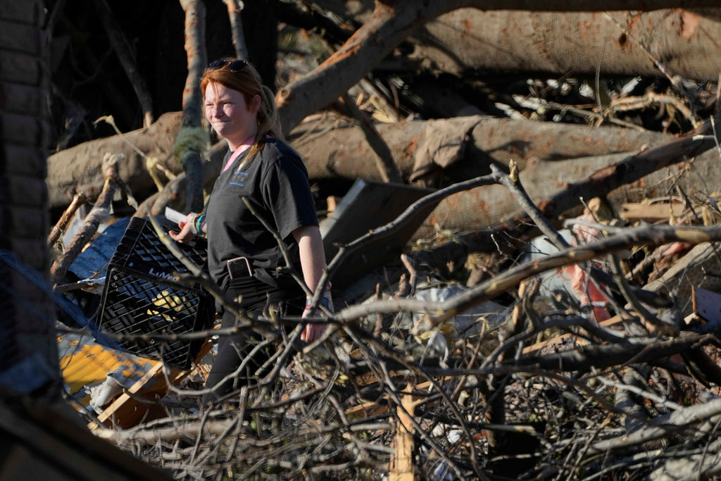 Biden declares emergency as crews dig through storm wreckage