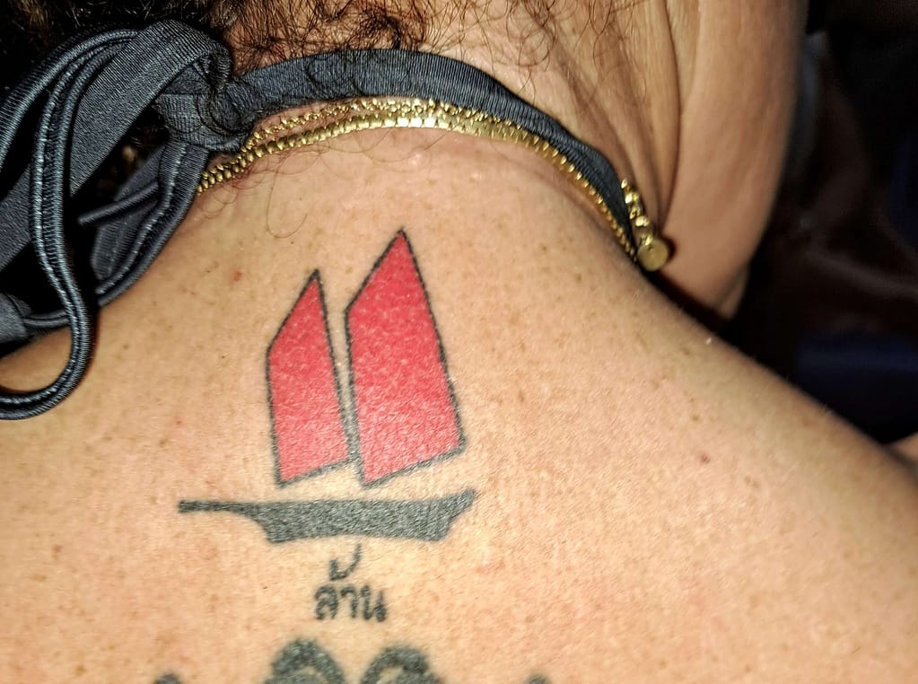 red and black bamboo tattoo of krabi boat tour