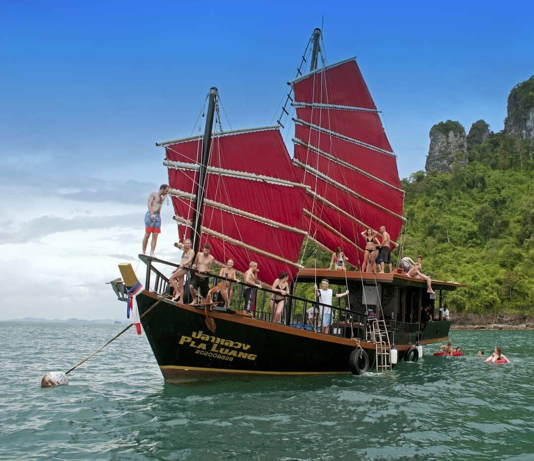 Traditional Siamese junk boat on a private morning cruise among the Krabi islands.