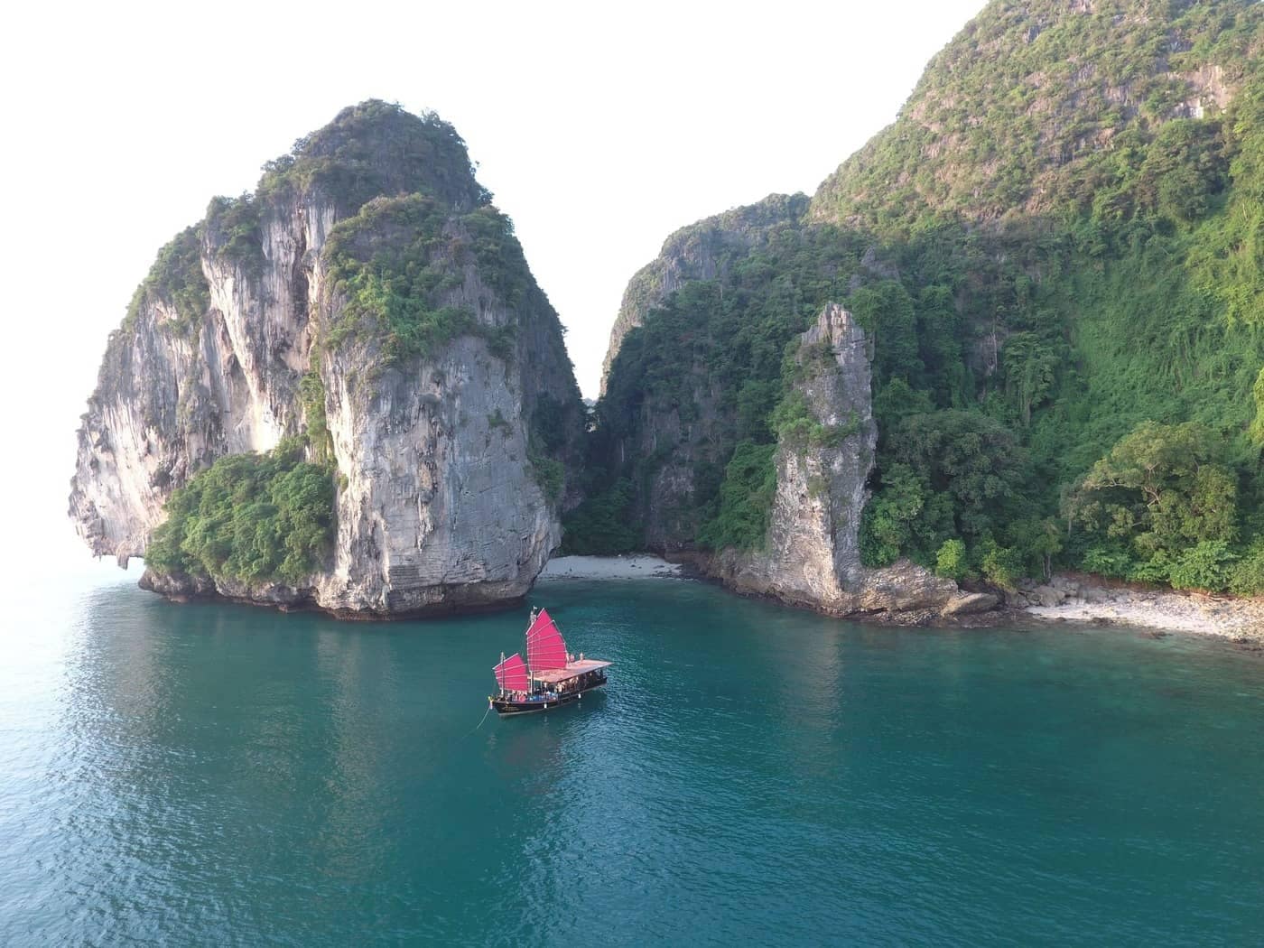 Krabi Sunset Cruises junk boat sailing by secret beach at Poda Island