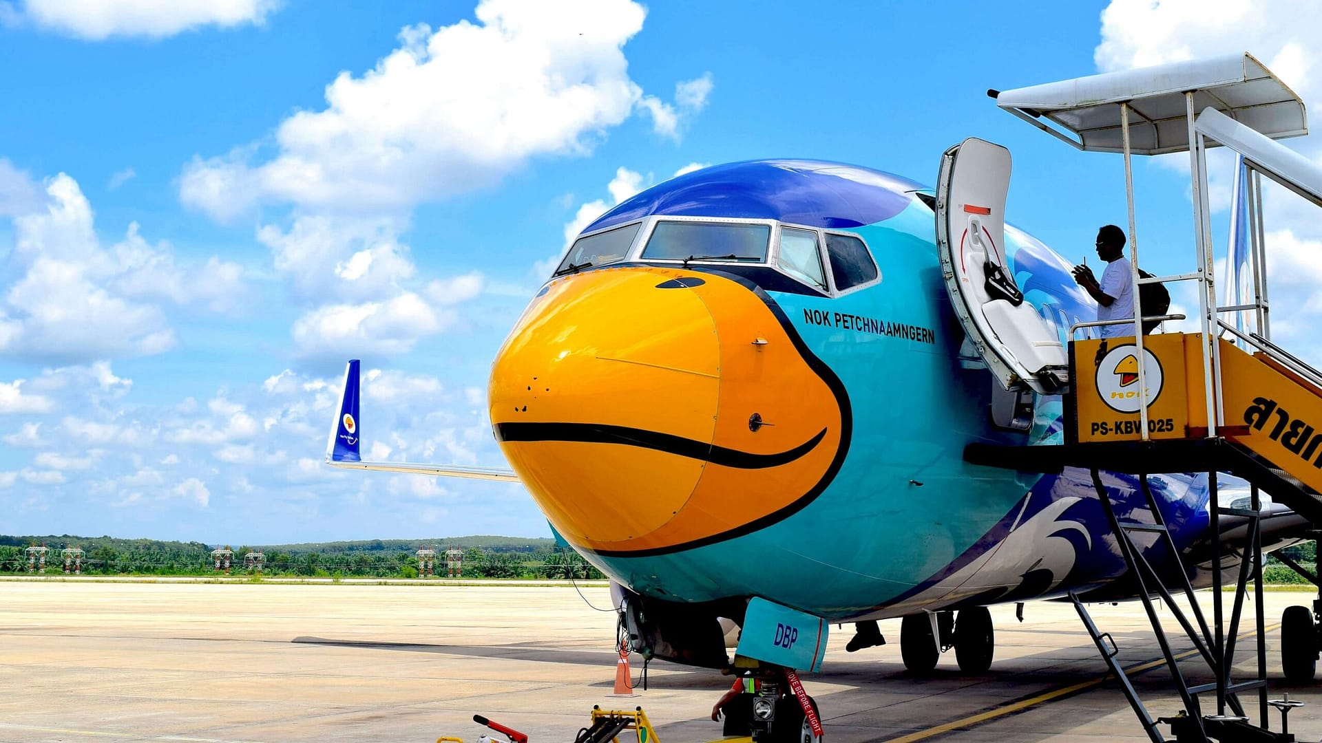 thai plane on runway at stand at krabi airport