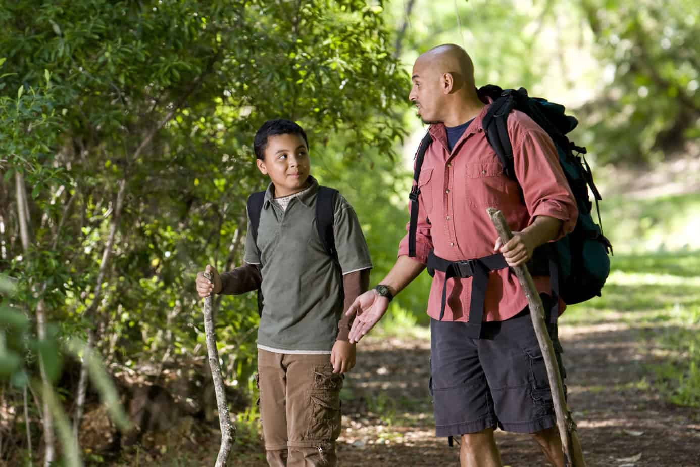 how to talk to your kid about porn -- teen boy hiking with his dad