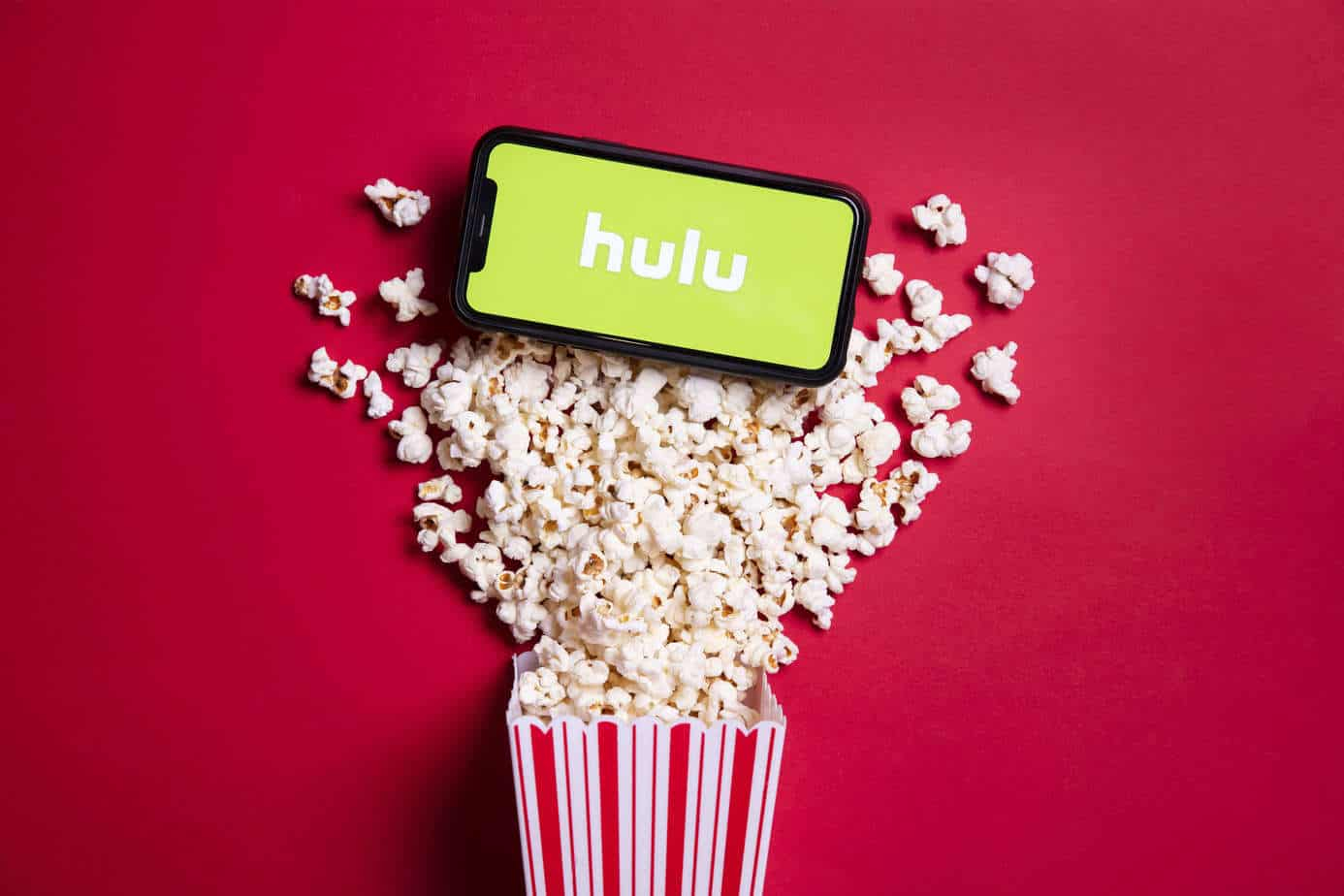 hulu parental controls - hulu app logo phone screen with popcorn in the background