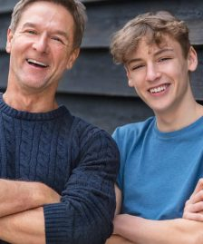 Happy Middle Aged Man Father and Teenage Son Arms Folded