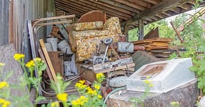 What Is the Quickest Method To Clean a Hoarder’s House? 1 junk piled outside hoarders house