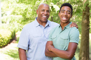 African American father and teen son.