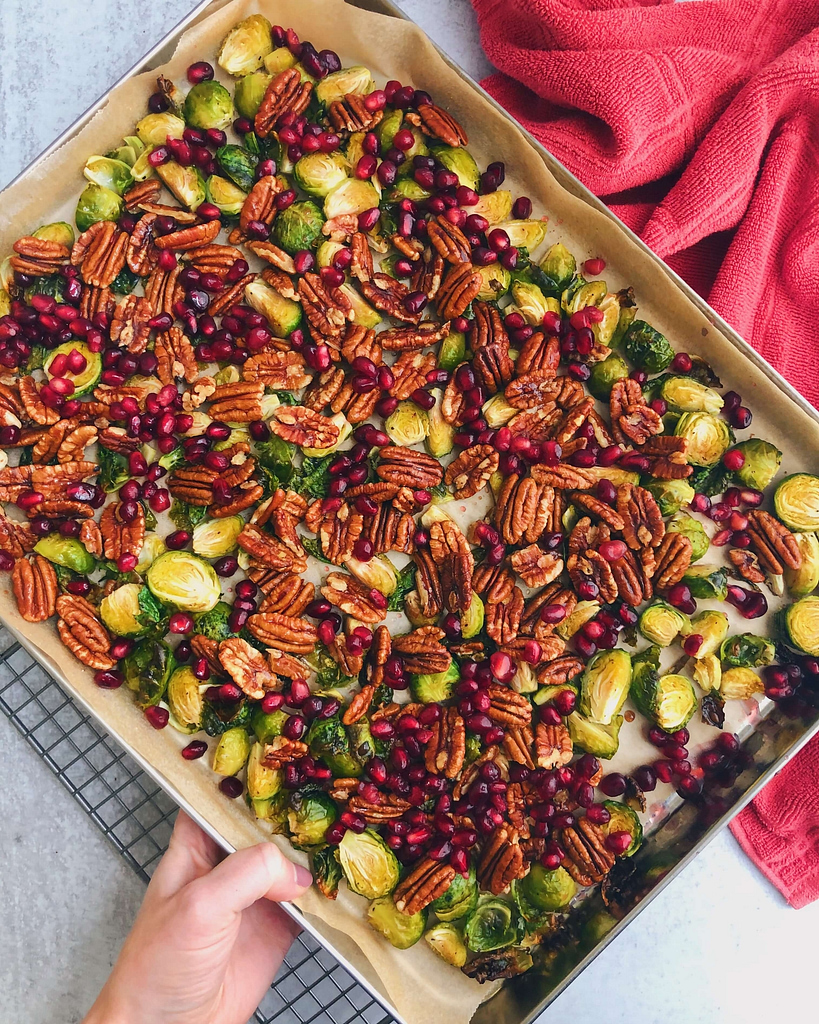 Pecan And Pomegranate Seed Brussels Sprouts: A delicious and nutrient-filled side dish perfect for holiday parties and the winter season. #healthyfood | www.jillzguerin.com