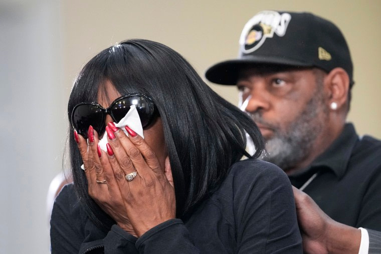 RowVaughn Wells, mother of Tyre Nichols cries as she is comforted by Tyre's stepfather Rodney Wells, at a news conference with civil rights Attorney Ben Crump in Memphis, Tenn.