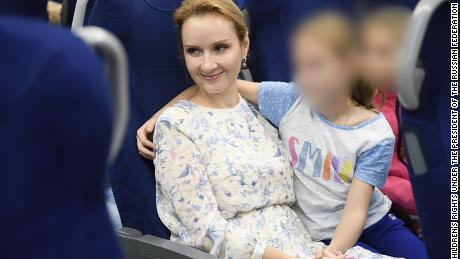 Russia's Commissioner for Children's Rights Maria Lvova-Belova pictured with what her office said are orphans from Donbas who have been sent to Russia's Nizhny Novgorod region. The image was released by Lvova-Belova's office in September. CNN obscured portions of this image to protect the identity of the children. 