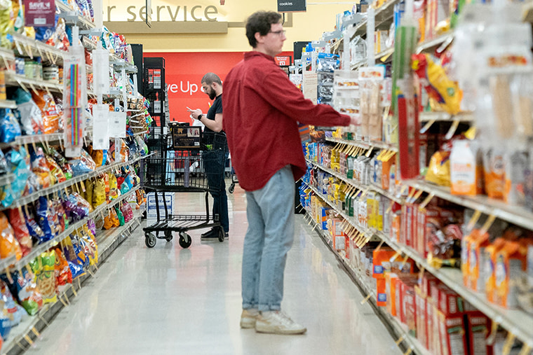 Shoppers look at items displayed at a grocery store in Washington, DC, on February 15.