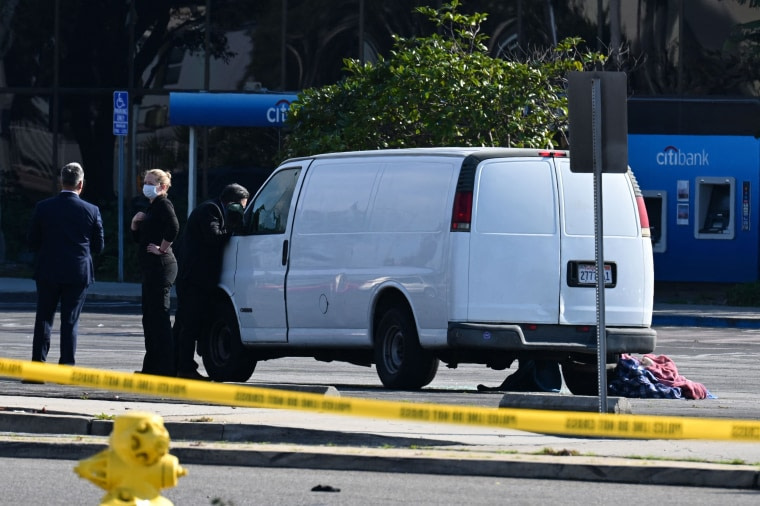 California police hunting the gunman who killed 10 people at a dance club during Lunar New Year celebrations broke into a van after a lengthy standoff Sunday, where images showed a body slumped in the driver's seat. The hunt began 12 hours earlier after a man -- described by police as Asian -- began firing at a club in Monterey Park, a city in Los Angeles County with a large Asian community.