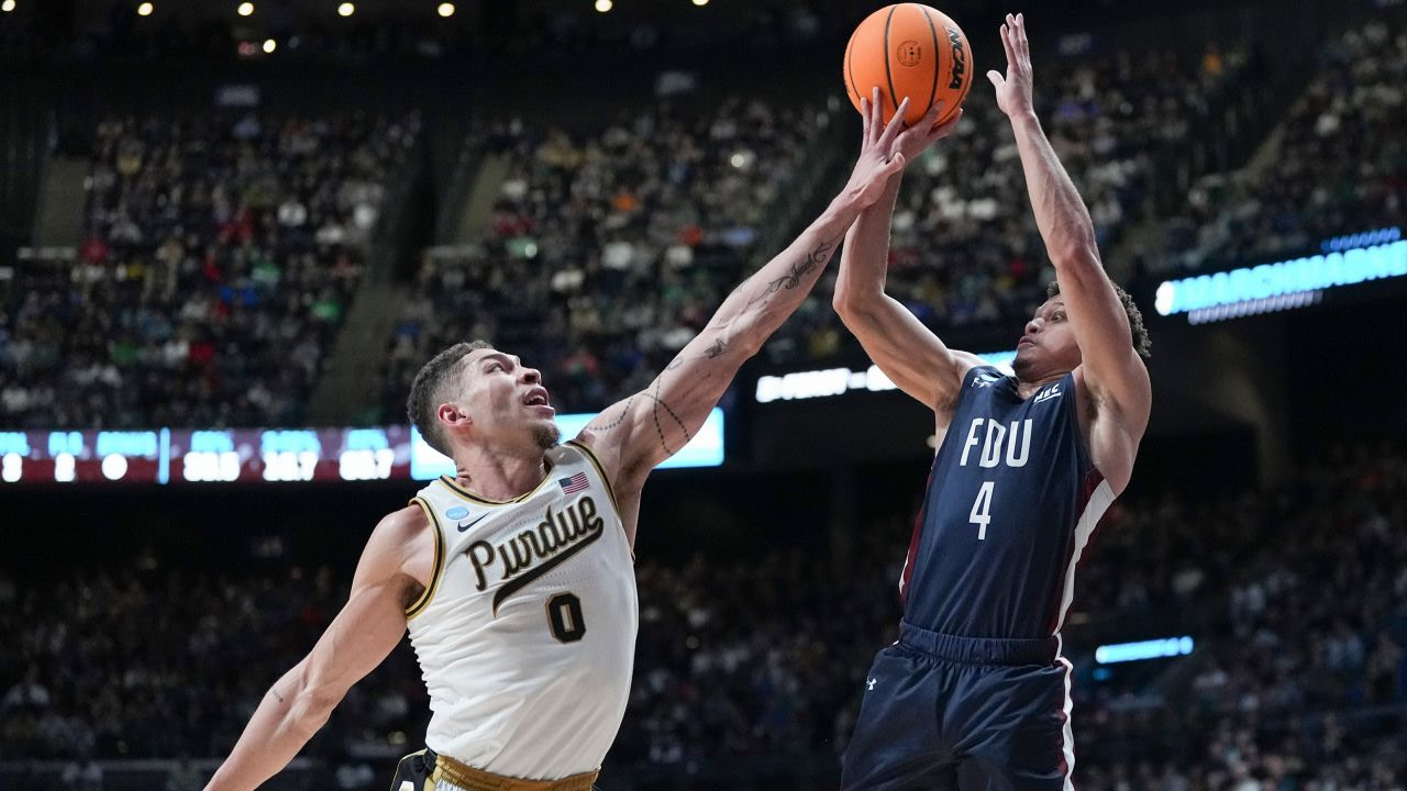 Grant Singleton, #4 of the Fairleigh Dickinson Knights, shoots over Mason Gillis, #0 of the Purdue Boilermakers, during the second half in the first round of the NCAA Men's Basketball Tournament at Nationwide Arena on Friday in Columbus, Ohio.