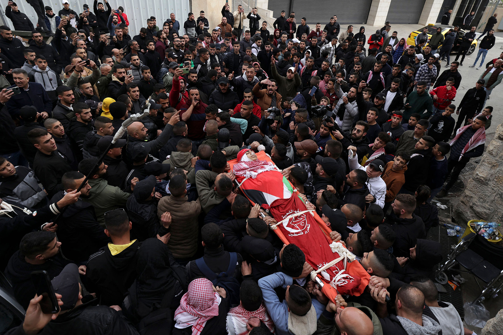 Funeral for Palestinian boy killed during Israeli raid highlights growing tensions
