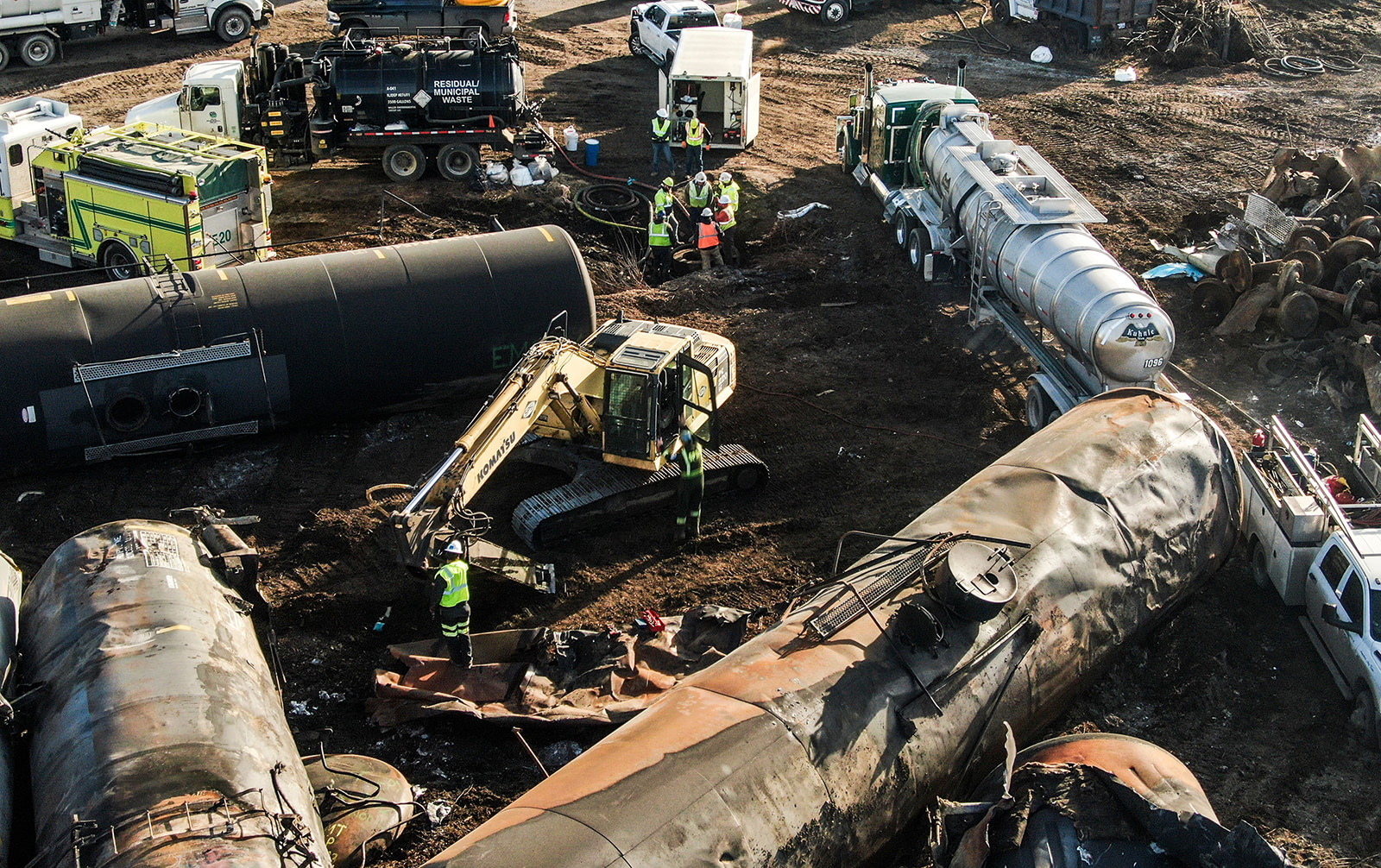 An aerial photo shows workers and damaged tank cars in East Palestine, Ohio, on February 18, as cleanup continues in the aftermath of the Norfolk Southern freight train derailment.