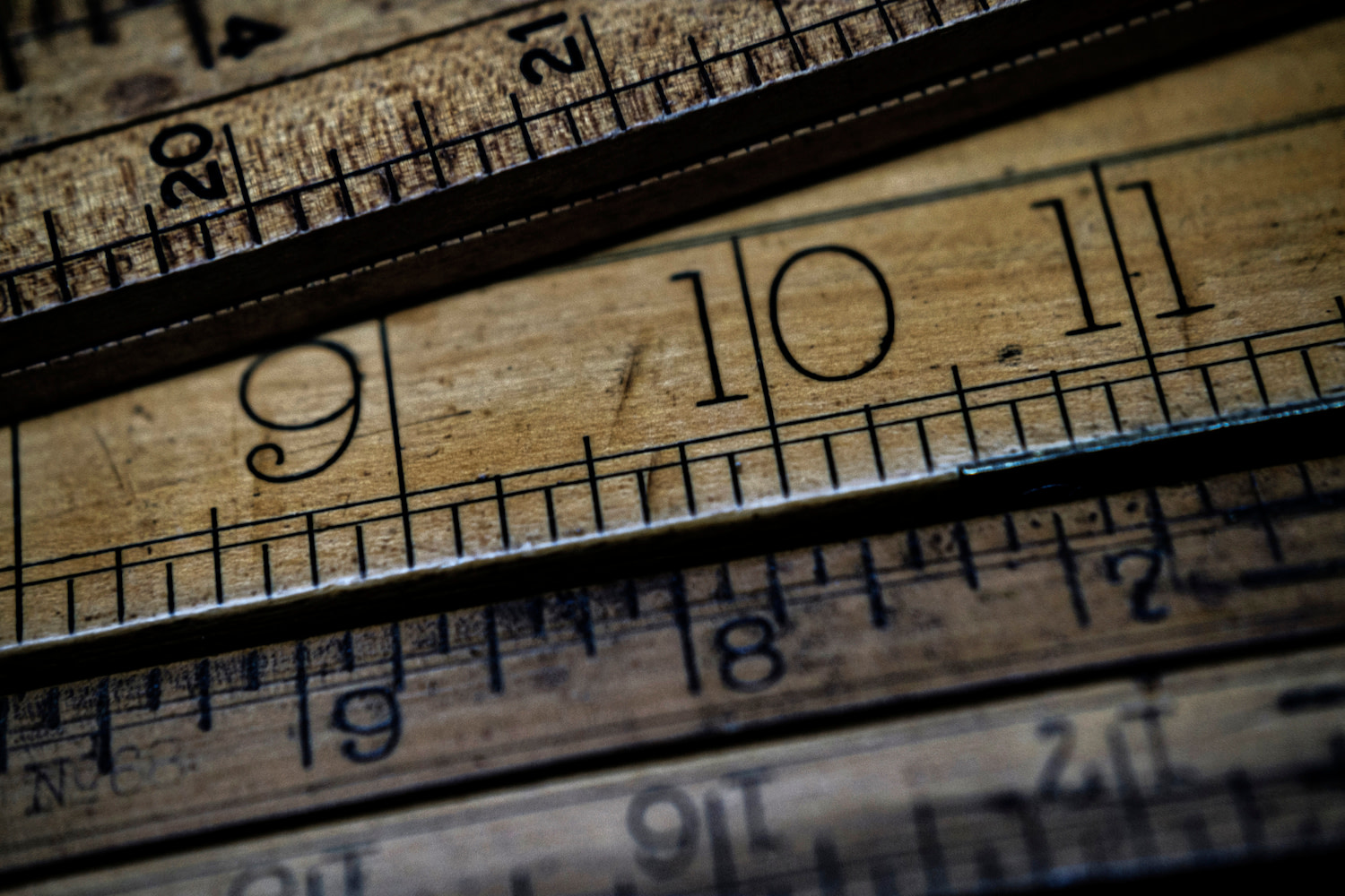 Close up of several wooden rulers