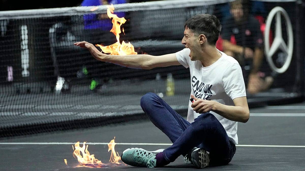 Laver Cup 2022: Climate change protester storms the court, lights arm on fire