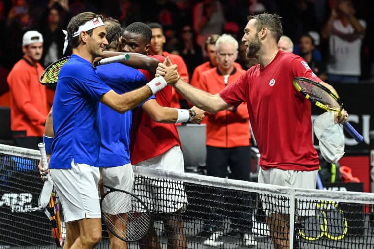 Image: Switzerland's Roger Federer, left, playing with Spain's Rafael Nadal of Team Europe shakes hands with USA's Jack Sock, right, of Team World after their 2022 Laver Cup men's doubles tennis match at the O2 Arena in London, early on Sept. 24, 2022.